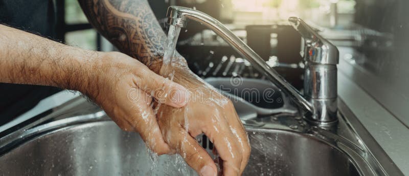 A man washing his hands with foam hand wash for corona virus prevention, hygiene to stop spreading coronavirus. A man washing his hands with foam hand wash for corona virus prevention, hygiene to stop spreading coronavirus.