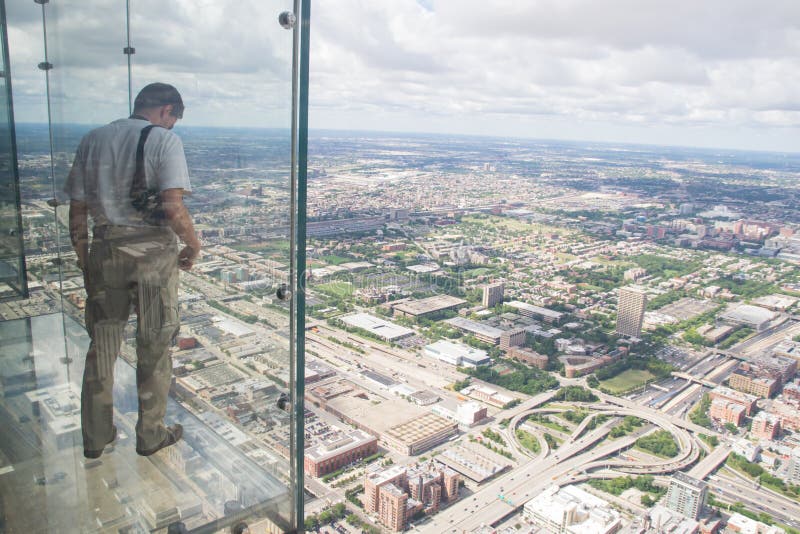 Chicago,USA-august 13,2013:the tallest building in the western hemisphere and the third tallest in the world. At 1,353 feet in the air, the Ledgeâ€™s glass boxes extend out 4.3 feet from Skydeck. Chicago,USA-august 13,2013:the tallest building in the western hemisphere and the third tallest in the world. At 1,353 feet in the air, the Ledgeâ€™s glass boxes extend out 4.3 feet from Skydeck