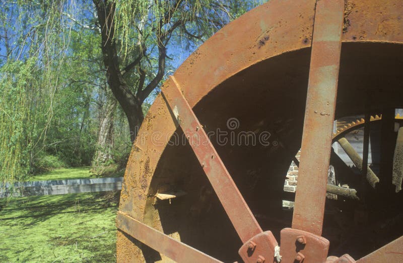 An old brown water mill in New England. An old brown water mill in New England