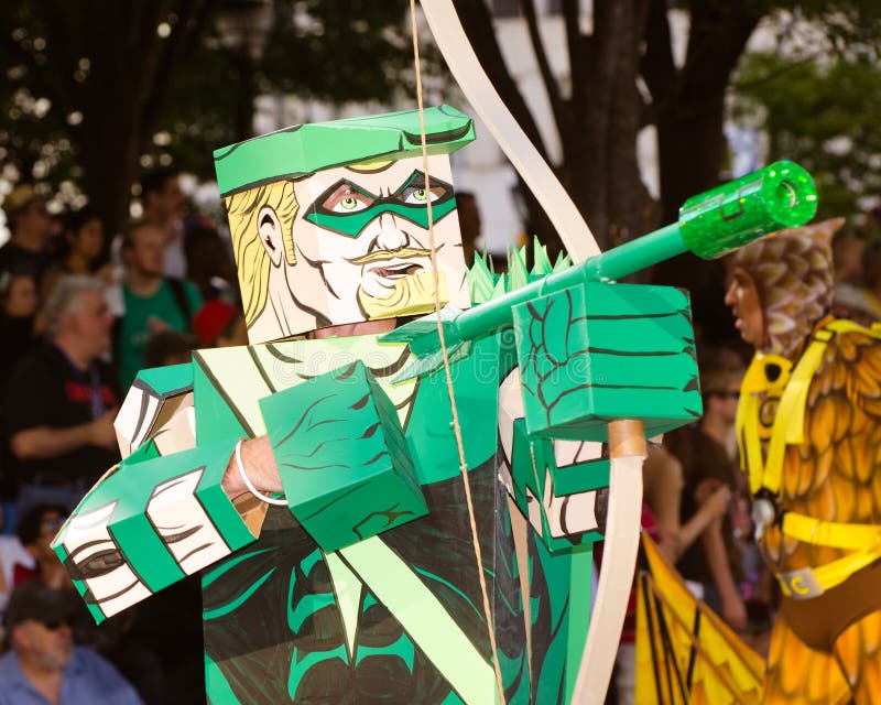 ATLANTA - Sept. 1: A comic book fan dressed as Green Arrow marches in the annual DragonCon parade on Sept. 1, 2012. DragonCon bills itself as the largest Sci-Fi convention in the world. ATLANTA - Sept. 1: A comic book fan dressed as Green Arrow marches in the annual DragonCon parade on Sept. 1, 2012. DragonCon bills itself as the largest Sci-Fi convention in the world.