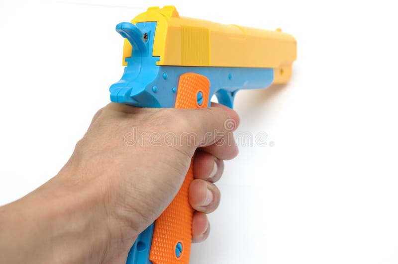 Uma Arma Colorida Da Mão Da Pistola Do Brinquedo Foto de Stock - Imagem de  revestimentos, fundo: 121015934