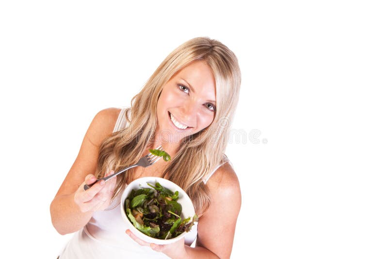 Uma Mulher Saudável Com Salada No Fundo Branco Foto de Stock