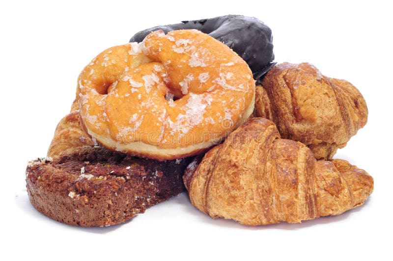 A pile of pastries, such as croissants, donuts and chocolate pie, on a white background. A pile of pastries, such as croissants, donuts and chocolate pie, on a white background