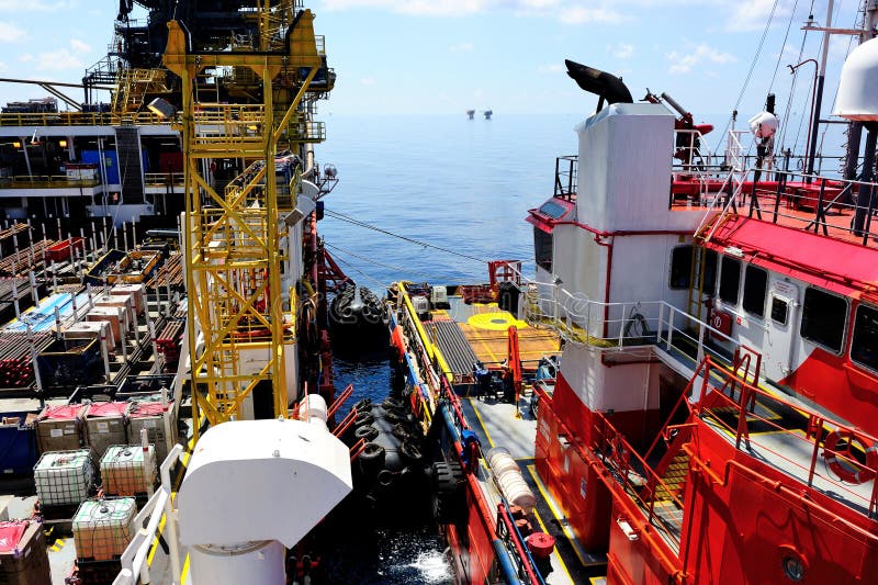 A supply vessel docking at an oil rig. A supply vessel docking at an oil rig