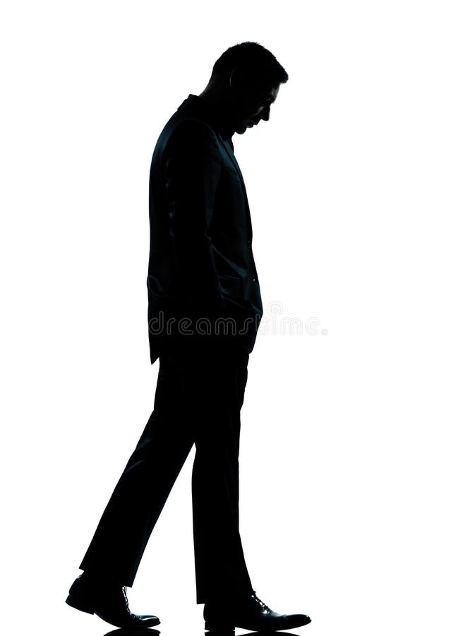 Uma vista de passeio do homem de negócio abaixo da silhueta fotografia de stock royalty free Uma vista de passeio do homem de negócio abaixo da silhueta fotografia de stock royalty free