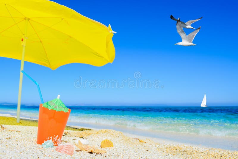 Umbrella and cocktail under flying gull royalty free stock images