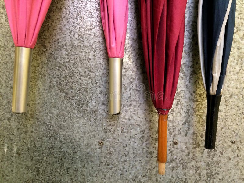 Umbrellas Hanging on Metallic Surface Wall Stock Photo Image of black