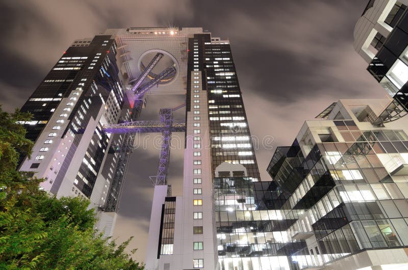 Looking up at the modern Umeda Sky Building in Osaka, Japan. Originally designed as 4 towers, the 2 tower structure is interconnected at the uppermost floors.