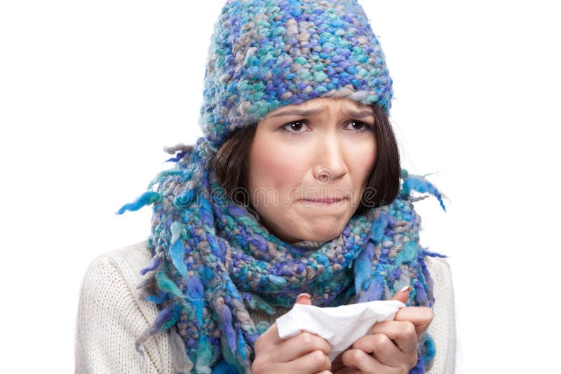 A cold young woman holding wipe in her hands, isolated. A cold young woman holding wipe in her hands, isolated