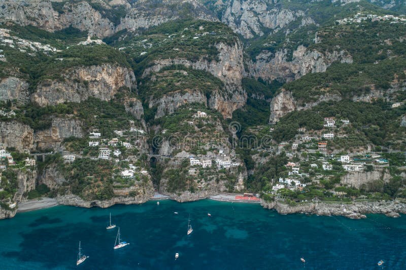 Aerial drone shot ivew of Amalfi coast road on mountain crags in the early morning. Aerial drone shot ivew of Amalfi coast road on mountain crags in the early morning