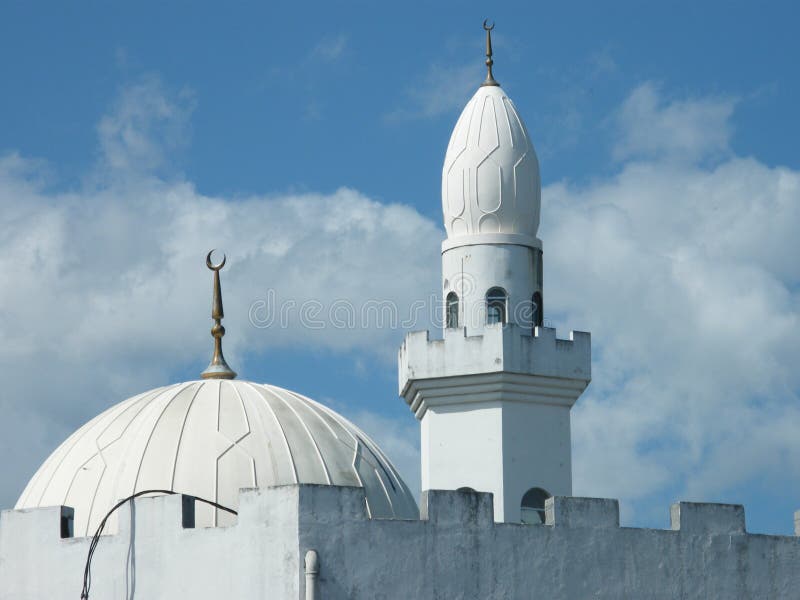 A domed roof and turret of a local mosque in the town of Moroni, the capital city of the Comoros Islands. A domed roof and turret of a local mosque in the town of Moroni, the capital city of the Comoros Islands