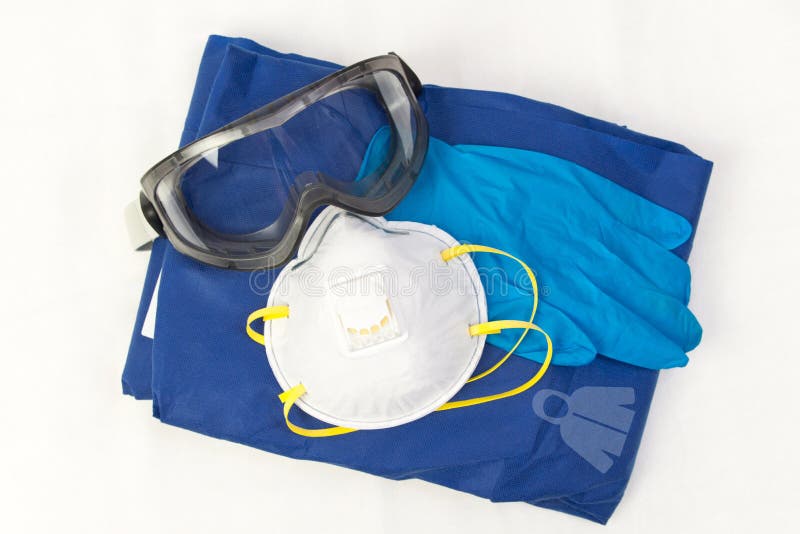 A set of Personal protection equipment against respiratory viral infections. Protective glasses , disposable gloves, suit and an antiseptic prevent the spread of infection on a white background. CoronaVirus Cavid-19. A set of Personal protection equipment against respiratory viral infections. Protective glasses , disposable gloves, suit and an antiseptic prevent the spread of infection on a white background. CoronaVirus Cavid-19