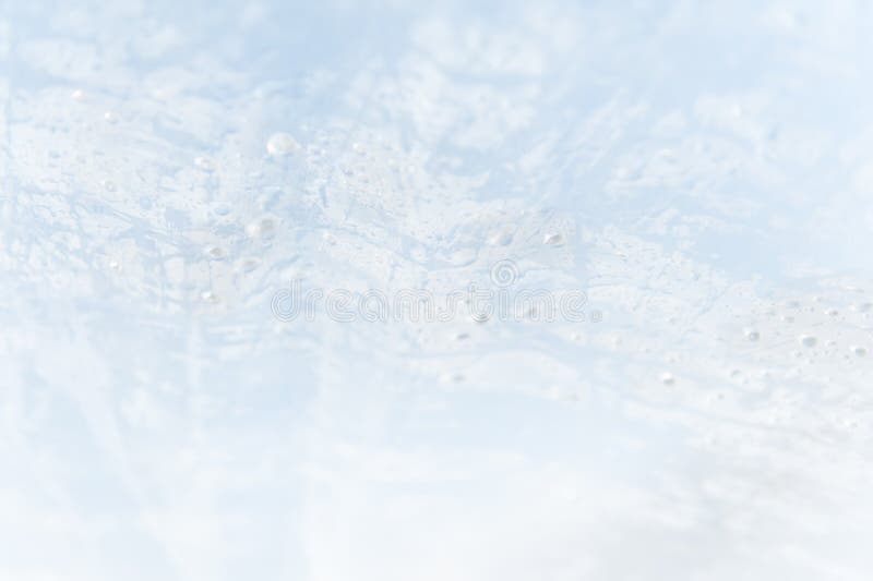 Un fond texturisé de bleu et blanc abstrait avec des baisses de l'humidité photos stock Un fond texturisé de bleu et blanc abstrait avec des baisses de l'humidité photos stock