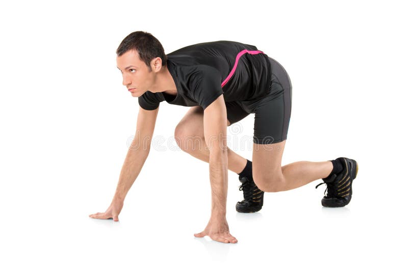 Un giovane atleta pronto a correre immagine stock libera da diritti