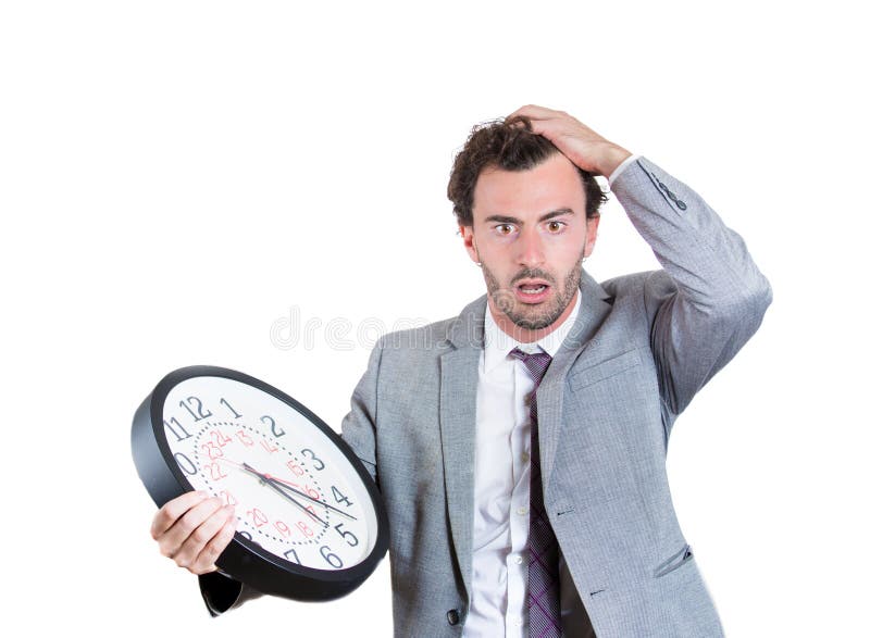 Un hombre de negocios se preocupó que él está corriendo de tiempo imagen de archivo Un hombre de negocios se preocupó que él está corriendo de tiempo imagen de archivo