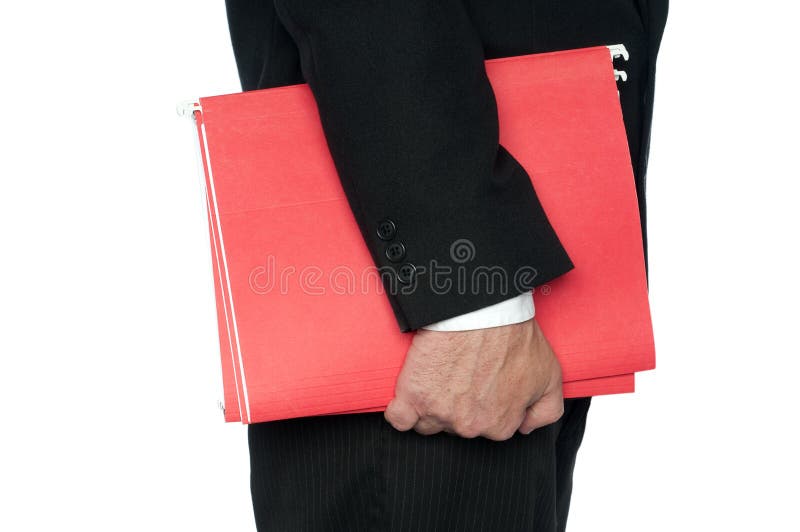 Un hombre en carpetas de asunto de un fichero rojas del juego imagen de archivo Un hombre en carpetas de asunto de un fichero rojas del juego imagen de archivo