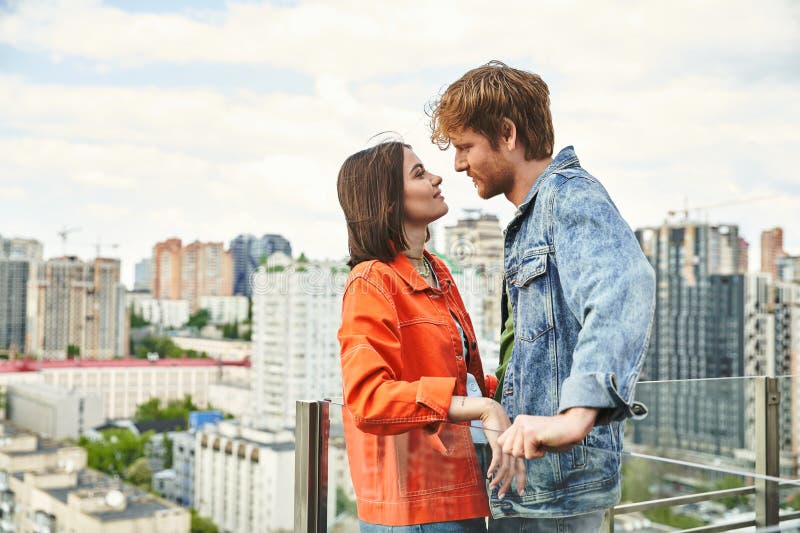 A men and a women standing close together, sharing a moment of connection and understanding, stock photo. A men and a women standing close together, sharing a moment of connection and understanding, stock photo