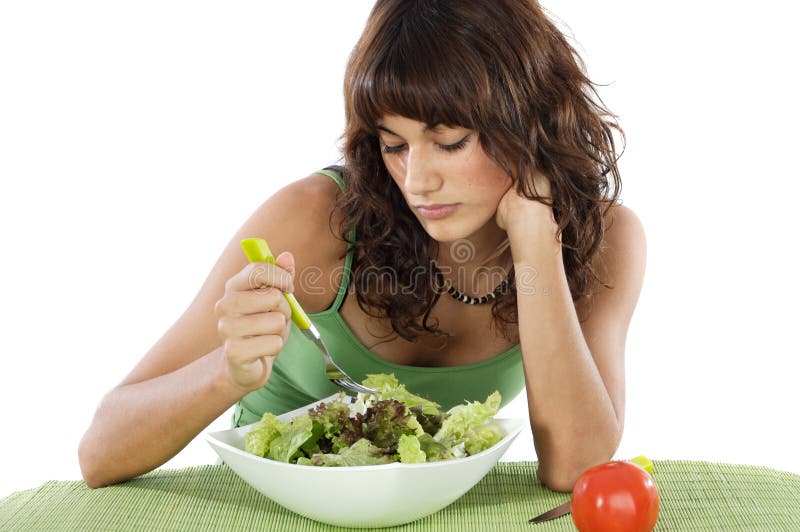 Un'insalata teenager triste di cibo immagini stock Un'insalata teenager triste di cibo immagini stock