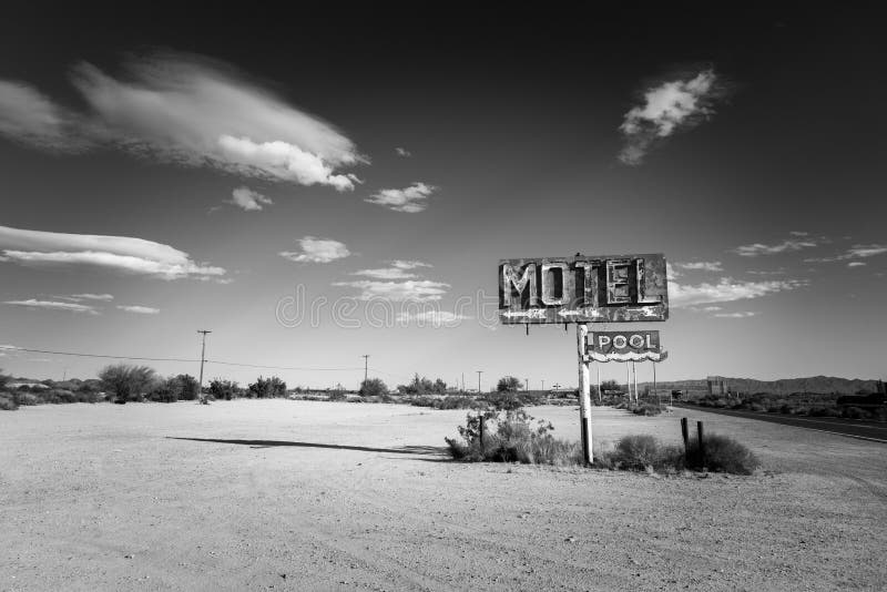 A dilapidated, classic, vintage motel sign in the desert of Arizona. A dilapidated, classic, vintage motel sign in the desert of Arizona
