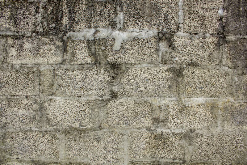 Un muro de cemento viejo del ladrillo con una textura áspera Superficie áspera pared de albañilería gris blanca sucia imagen de archivo Un muro de cemento viejo del ladrillo con una textura áspera Superficie áspera pared de albañilería gris blanca sucia imagen de archivo