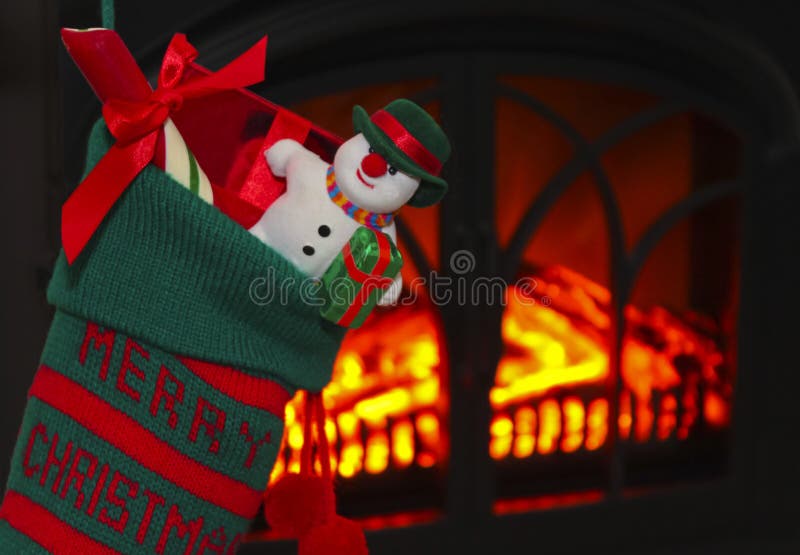 Un muñeco de nieve en una media en la Navidad imagenes de archivo Un muñeco de nieve en una media en la Navidad imagenes de archivo