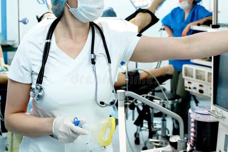 An intensive care physician prepares equipment for artificial ventilation of the lungs for intubation in a critical patient with coronavirus. COVID-19 epidemic affecting the respiratory system. An intensive care physician prepares equipment for artificial ventilation of the lungs for intubation in a critical patient with coronavirus. COVID-19 epidemic affecting the respiratory system