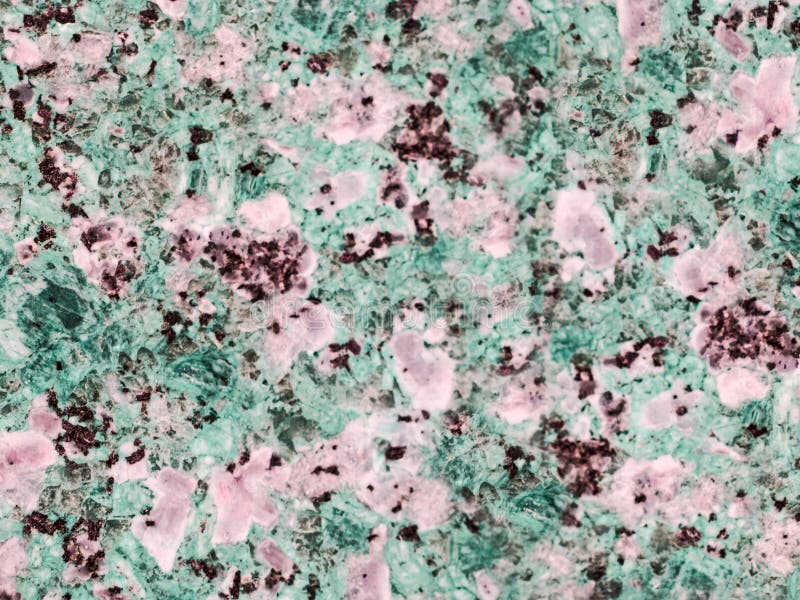 Un primer de una textura de una rosa y el granito pulido verde emergen foto de archivo Un primer de una textura de una rosa y el granito pulido verde emergen foto de archivo