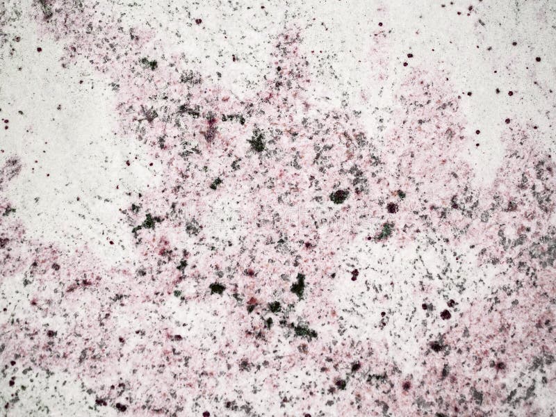 Un primer de una textura de una superficie color de rosa pulida de la roca del granito imagen de archivo Un primer de una textura de una superficie color de rosa pulida de la roca del granito imagen de archivo