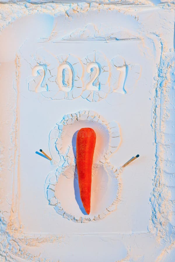 A snowman made of flour with carrots and matches. New Year`s Concept Postcard 2021. A snowman made of flour with carrots and matches. New Year`s Concept Postcard 2021.