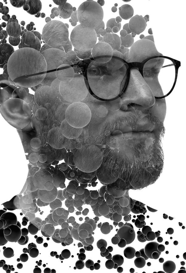 Un retrato de un hombre combinado con esferas 3d en una técnica de doble exposición. imagen de archivo libre de regalías
