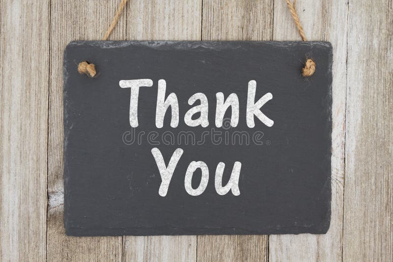 A rustic thank you message, A retro chalkboard on weathered wood background with text Thank You. A rustic thank you message, A retro chalkboard on weathered wood background with text Thank You