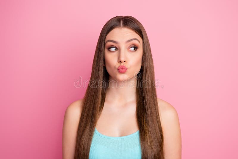 Close-up portrait of her she nice attractive lovely lovable winsome, curious cheerful cheery straight-haired girl sending air kiss looking aside  over pink pastel color background. Close-up portrait of her she nice attractive lovely lovable winsome, curious cheerful cheery straight-haired girl sending air kiss looking aside  over pink pastel color background