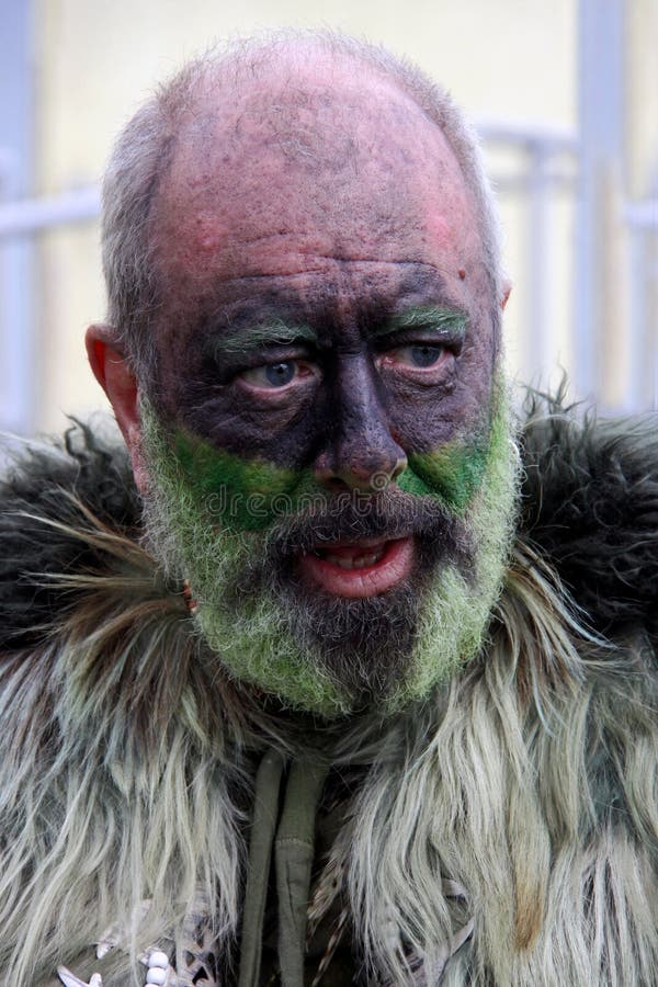 A man at Jack In The Green Festival, May Day Weekend, Hastings Castle, Hastings UK, May 3rd 2010. an annual festival which celebrates life, death, birth, fertility, unity, harvest, love, peace, nature and the environment and features music and Morris Dancing typical of that Bank Holiday Weekend. A man at Jack In The Green Festival, May Day Weekend, Hastings Castle, Hastings UK, May 3rd 2010. an annual festival which celebrates life, death, birth, fertility, unity, harvest, love, peace, nature and the environment and features music and Morris Dancing typical of that Bank Holiday Weekend