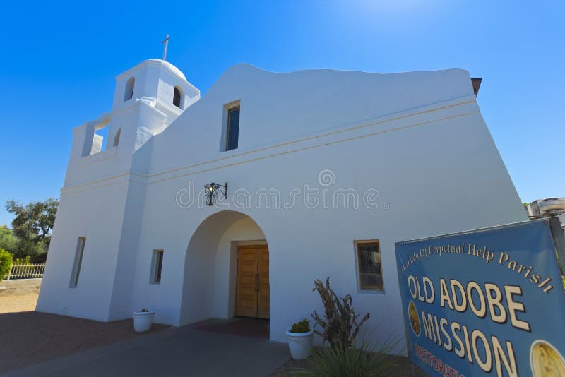 SCOTTSDALE, ARIZONA - JUNE 10: The Old Adobe Mission on June 10, 2013, in Old Town Scottsdale, Arizona. Built by the Mexican Catholics in 1932 and dedicated to Our Lady of Perpetual Help, the Mission was used as a main parish Church until 1948. SCOTTSDALE, ARIZONA - JUNE 10: The Old Adobe Mission on June 10, 2013, in Old Town Scottsdale, Arizona. Built by the Mexican Catholics in 1932 and dedicated to Our Lady of Perpetual Help, the Mission was used as a main parish Church until 1948.