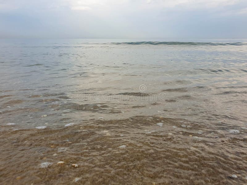 A warm summer morning on the coast of the Black sea. Anapa, Krasnodar region. Calm sea, sunrise. A warm summer morning on the coast of the Black sea. Anapa, Krasnodar region. Calm sea, sunrise