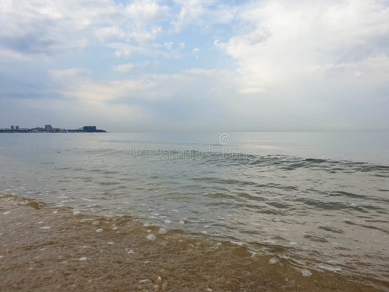 A warm summer morning on the coast of the Black sea. Anapa, Krasnodar region. Calm sea, sunrise. A warm summer morning on the coast of the Black sea. Anapa, Krasnodar region. Calm sea, sunrise