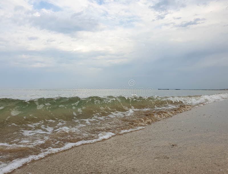 A warm summer morning on the coast of the Black sea. Anapa, Krasnodar region. Calm sea, sunrise. A warm summer morning on the coast of the Black sea. Anapa, Krasnodar region. Calm sea, sunrise