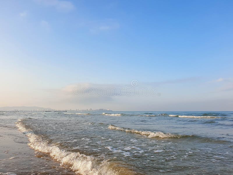 A warm summer morning on the coast of the Black sea. Anapa, Krasnodar region. Calm sea, sunrise. A warm summer morning on the coast of the Black sea. Anapa, Krasnodar region. Calm sea, sunrise