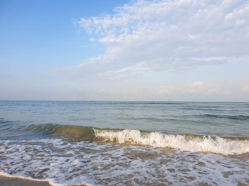 A warm summer morning on the coast of the Black sea. Anapa, Krasnodar region. Calm sea, sunrise. A warm summer morning on the coast of the Black sea. Anapa, Krasnodar region. Calm sea, sunrise