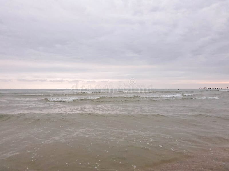 A warm summer morning on the coast of the Black sea. Anapa, Krasnodar region. Calm sea, sunrise. A warm summer morning on the coast of the Black sea. Anapa, Krasnodar region. Calm sea, sunrise