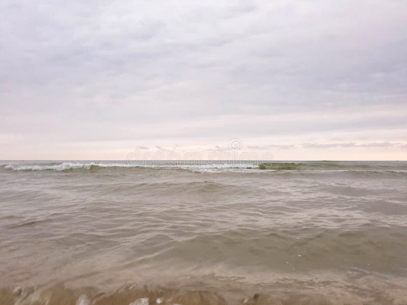 A warm summer morning on the coast of the Black sea. Anapa, Krasnodar region. Calm sea, sunrise. A warm summer morning on the coast of the Black sea. Anapa, Krasnodar region. Calm sea, sunrise