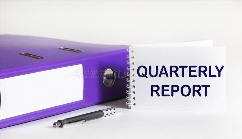 A folder with documents, a pen and a notepad with the text QUARTERLY REPORT on a white background. A folder with documents, a pen and a notepad with the text QUARTERLY REPORT on a white background.