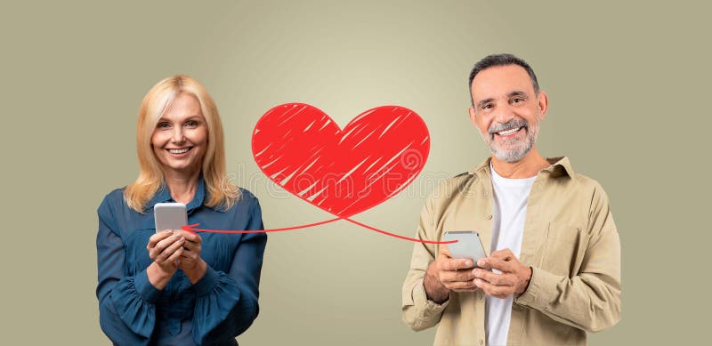 Una coppia che festeggia l'amore il giorno di San Valentino con i telefoni con il cuore fotografia stock