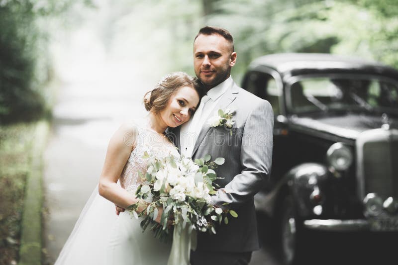 Just married couple in the luxury retro car on their wedding day. Just married couple in the luxury retro car on their wedding day.