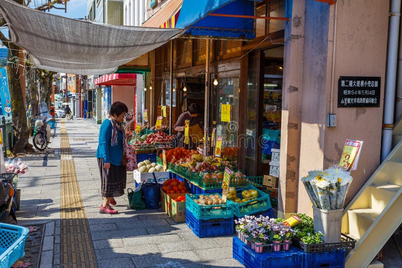 NAGASAKI, JAPAN - NOVEMBER 14: Grocery store in Nagasaki, Japan on November 14, 2013. A Traditional grocery store nearby Nagasaki peace park which is hard to see while the modern mini marts make an invasion. NAGASAKI, JAPAN - NOVEMBER 14: Grocery store in Nagasaki, Japan on November 14, 2013. A Traditional grocery store nearby Nagasaki peace park which is hard to see while the modern mini marts make an invasion