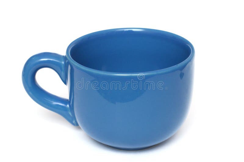 Una grande pianura tutta la tazza da caffè blu con la maniglia fotografie stock Una grande pianura tutta la tazza da caffè blu con la maniglia fotografie stock