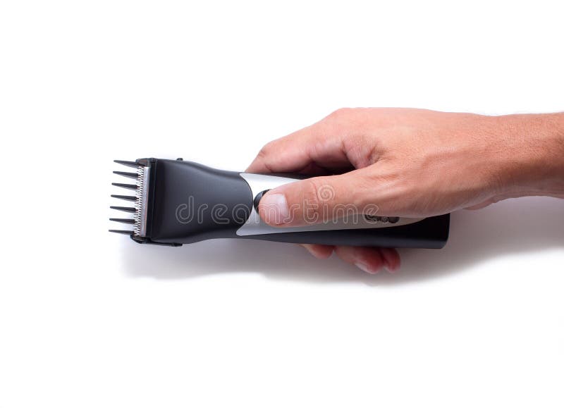 Una macchina dell'acconciatura barbershop Tosatrice a disposizione isolata su fondo bianco immagine stock libera da diritti Una macchina dell'acconciatura barbershop Tosatrice a disposizione isolata su fondo bianco immagine stock libera da diritti