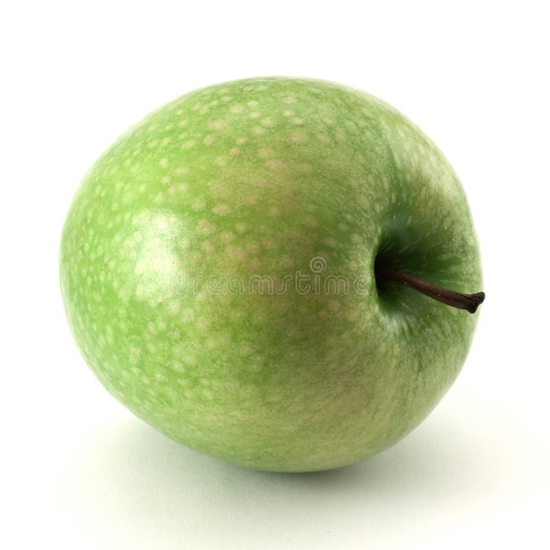 Una mela verde isolata su fondo bianco immagine stock libera da diritti Una mela verde isolata su fondo bianco immagine stock libera da diritti