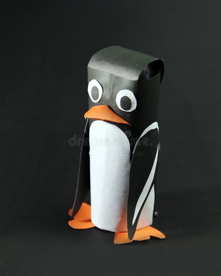 A penguin paper cruft. made of color paper attached with glue for school class project. A penguin paper cruft. made of color paper attached with glue for school class project