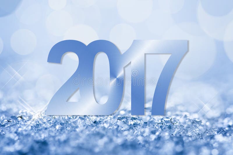 2017 blue snow and bokeh new year greeting card. 2017 blue snow and bokeh new year greeting card
